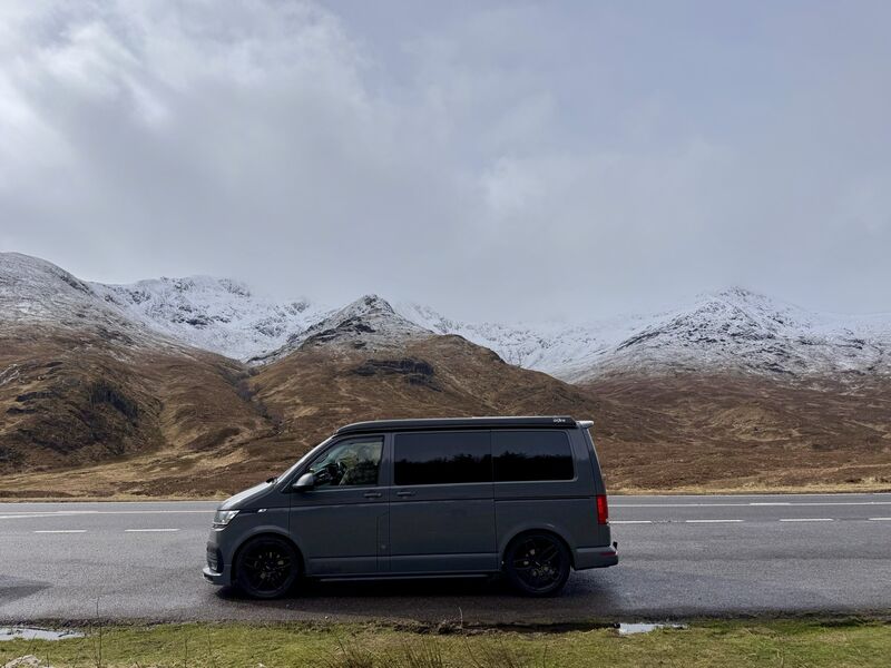 Scottish mountain landscape with campervan